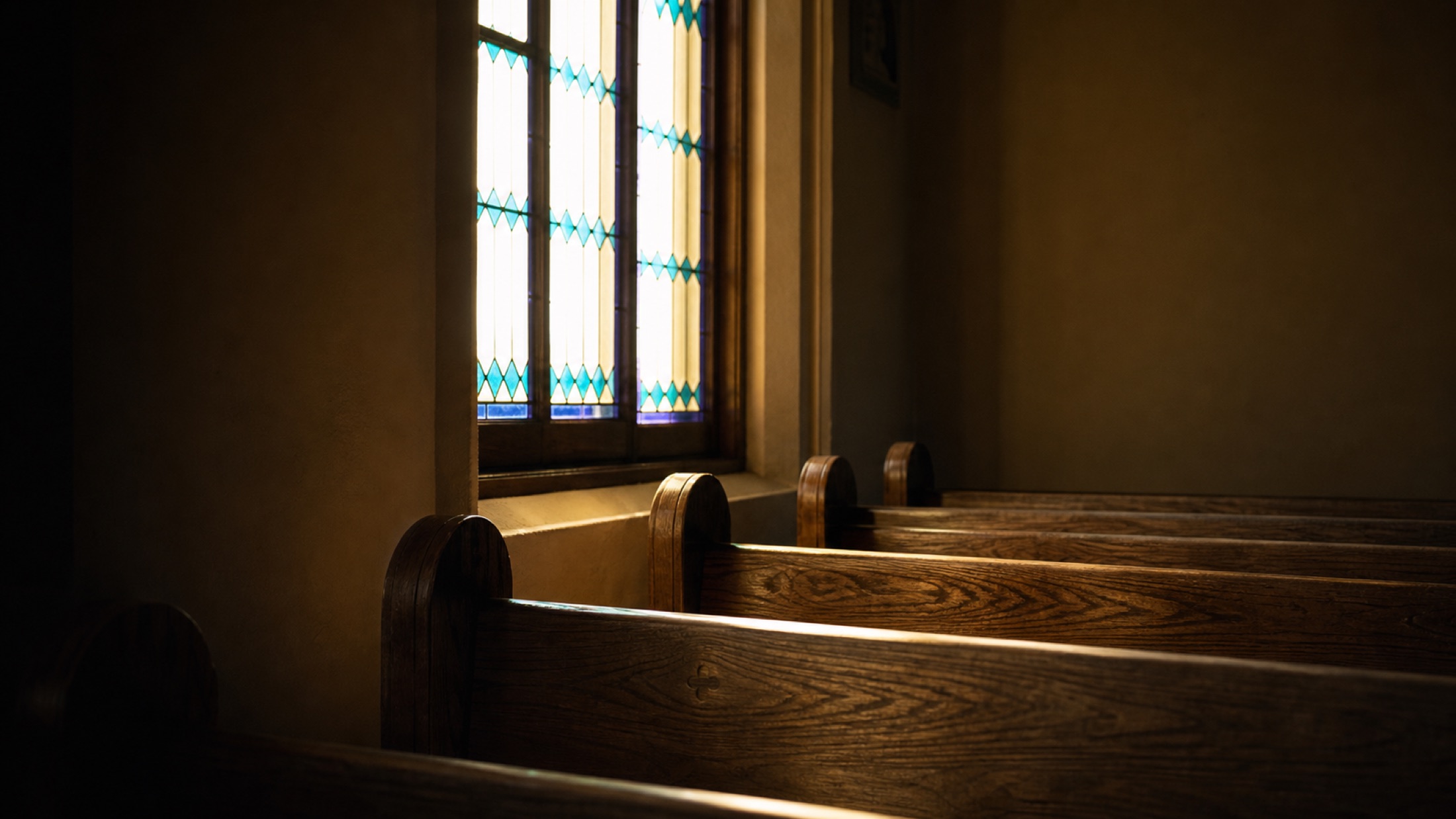 Empty pews and window light at RCCV