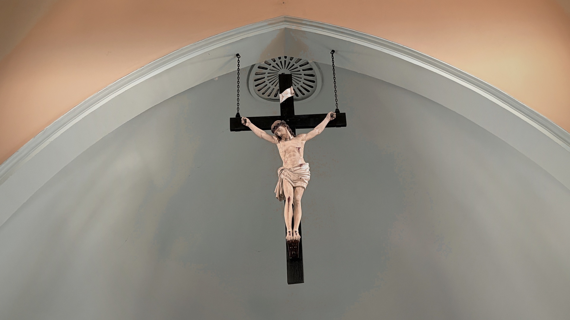 A quiet crucifix on the wall at St. James