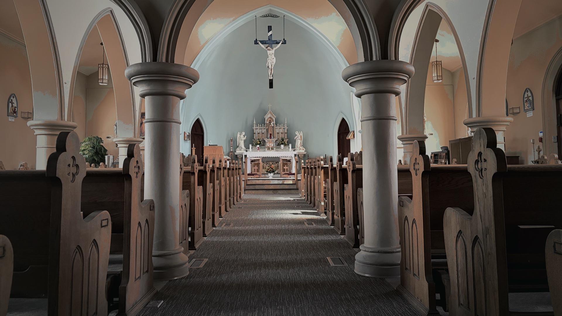 The central aisle of the church nave leading toward the sanctuary