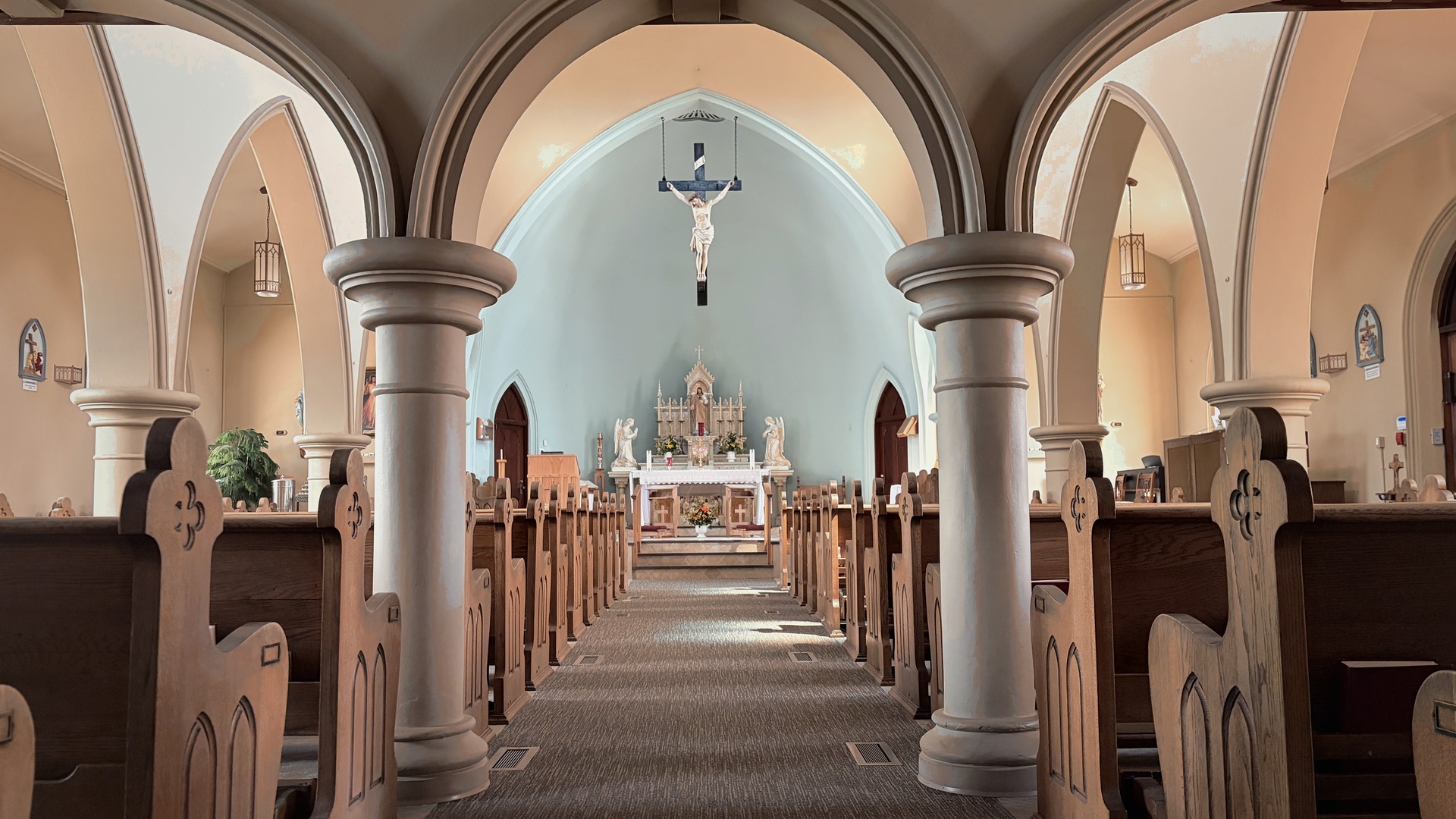 The nave of a parish church looking toward the altar, where the sacraments are celebrated.
