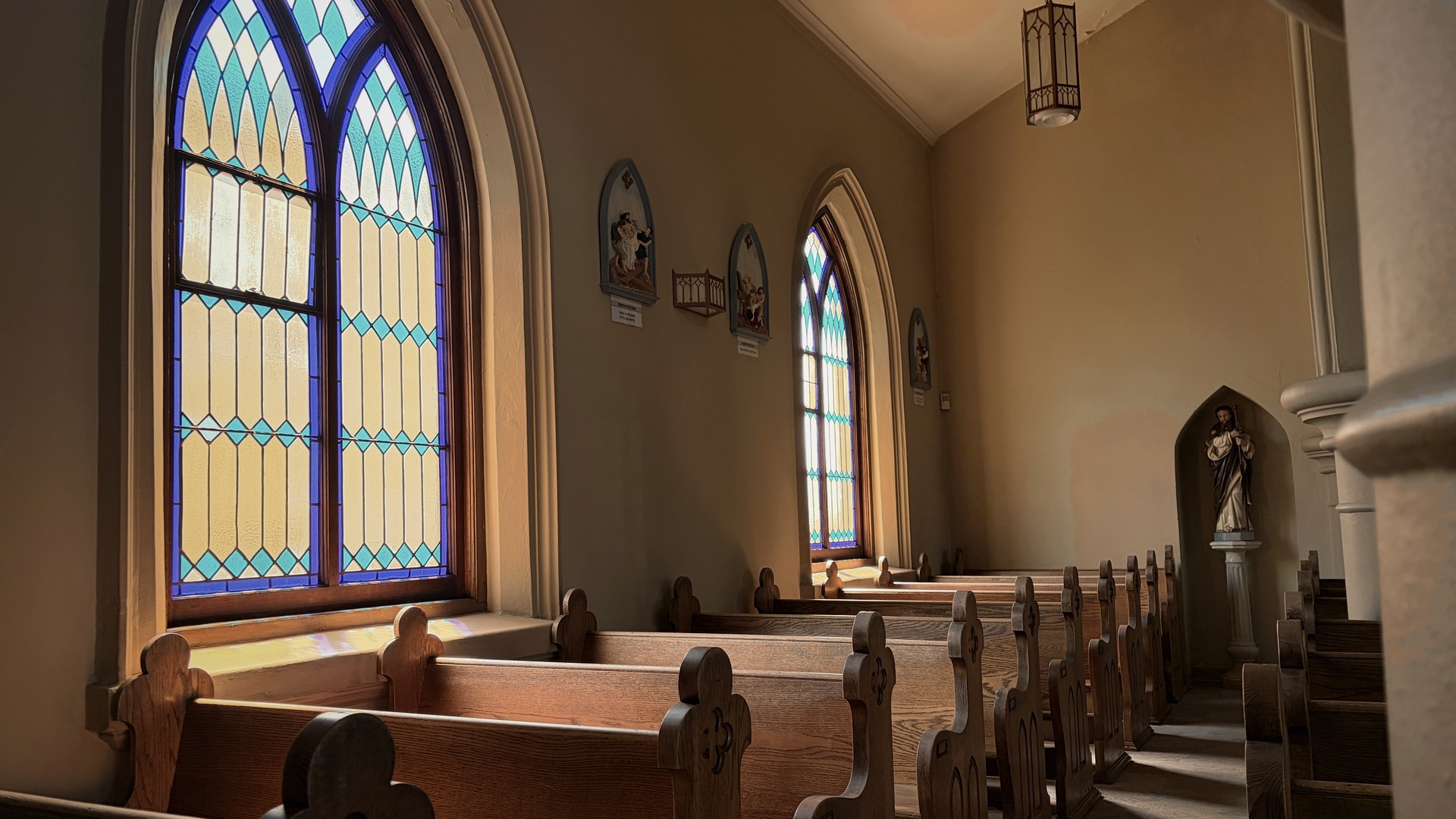 Empty pews of St. James in warm afternoon light