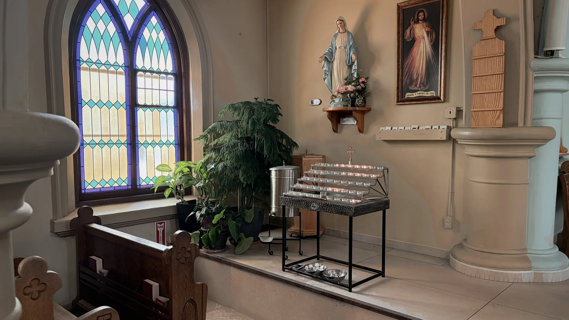 A quiet pew beside a sunlit window