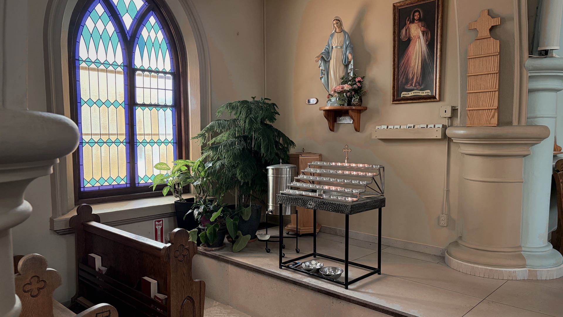 A quiet pew beside a sunlit window