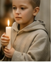 A child holding a candle for Candlemas.