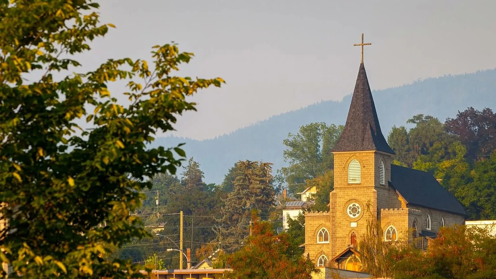 St. James church tower rising above the trees in the Vernon valley